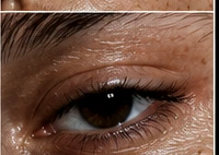 Macro detail of untouched skin: pores, freckles, texture.